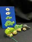 Hape Pull Along Frog Family, Anti-rollover Wheels; Plus Wood Turtle Knob Puzzle. Fixed Price $14.00.