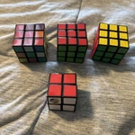 Lot Of 4 Rubiks Cubes - 3X3, 2X2, Tactile, Impossible. Fixed Price $15.00.